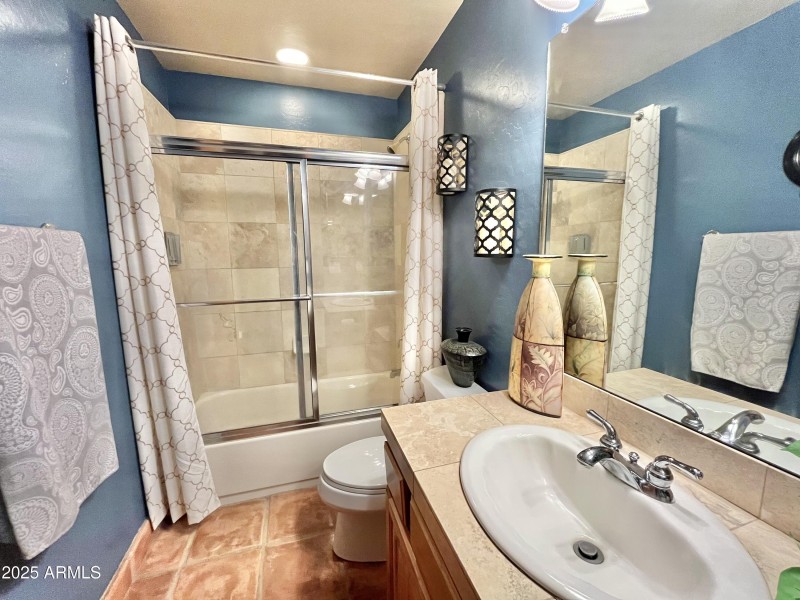 Bathroom 2 with tiled tub/shower