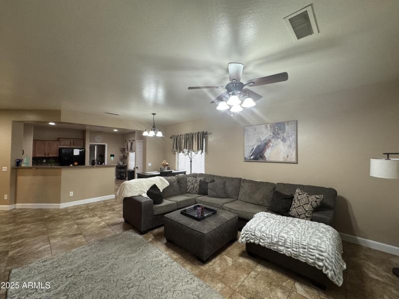 Living room with fan tile flooring