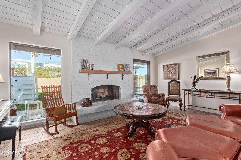 Beamed ceilings and cozy fireplace.