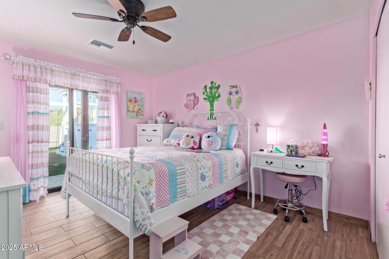 Bedroom #2 w/ backyard slider.