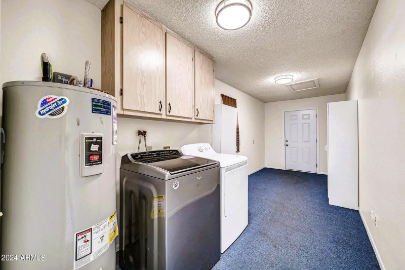Laundry and storage room off garage - 10