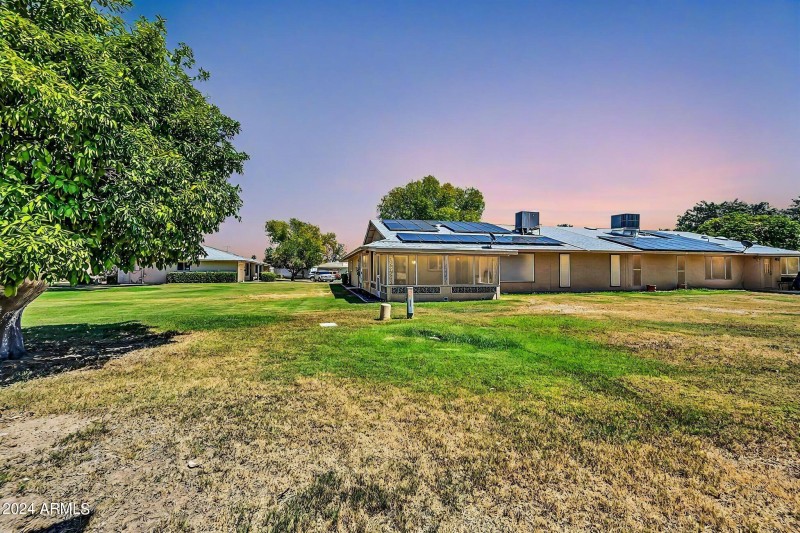 Back green area and home - twilight