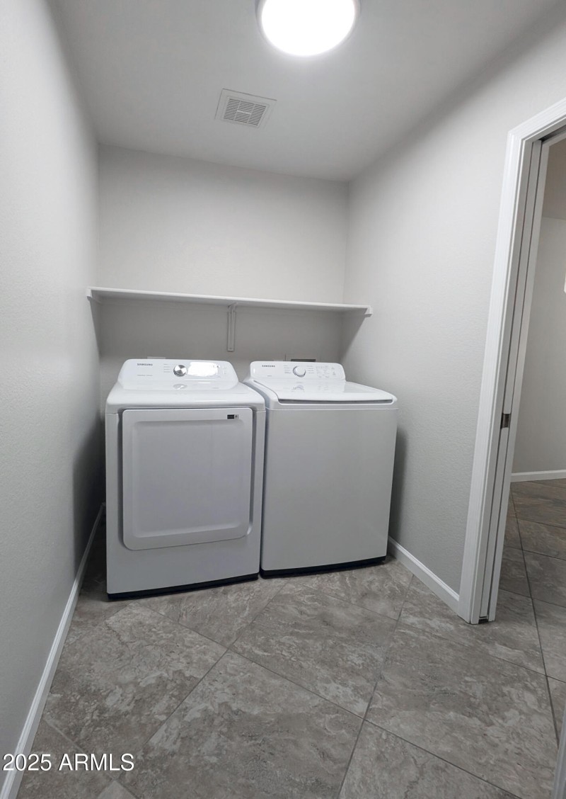 laundry room with newer Samsung washer-d