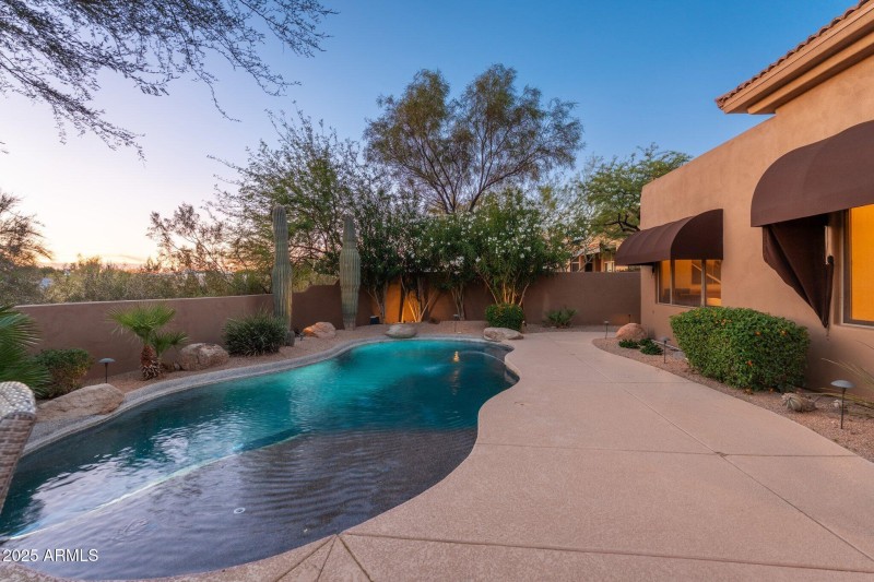 Backyard Pool View At Twilight