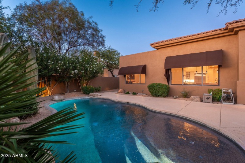 Backyard Pool View At Twilight