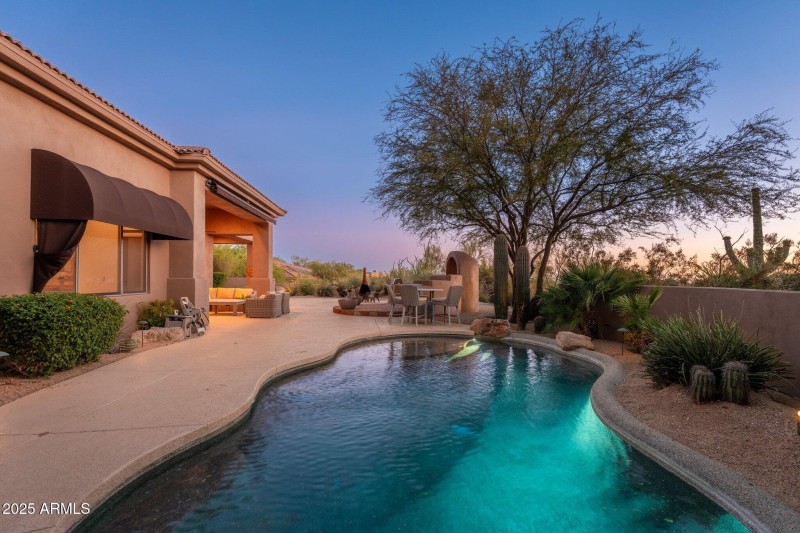 Backyard Pool View At Twilight