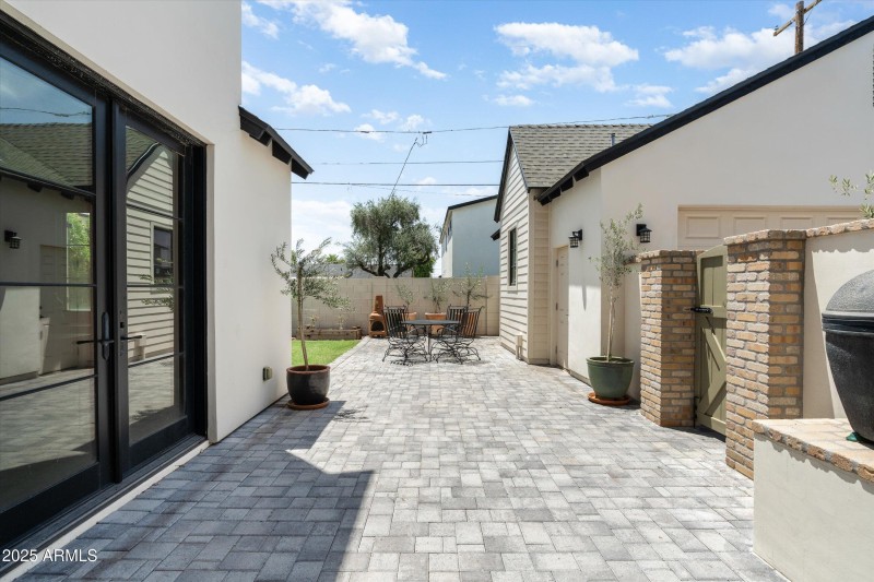 BBQ and walkway to detached garage