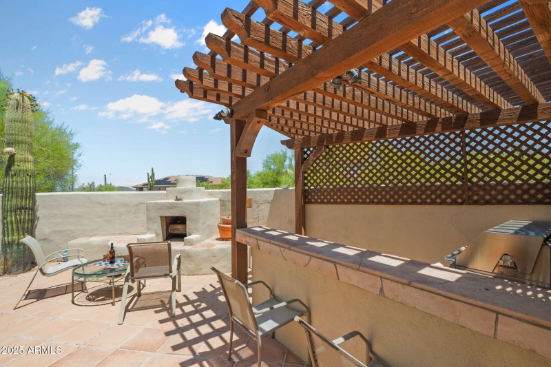 Covered kitchen with seating area