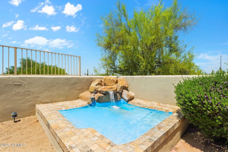 Heated spa with waterfall