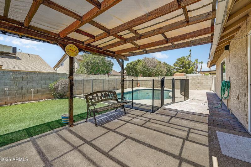 Patio between pool and turf