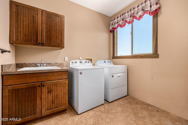 LAUNDRY RM WITH SINK & CABINETS
