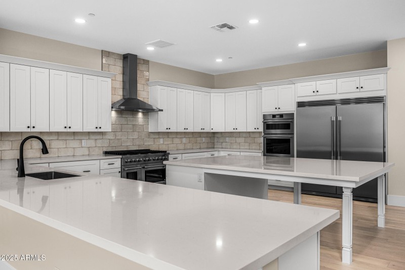 kitchen w/ 48" gas SS range