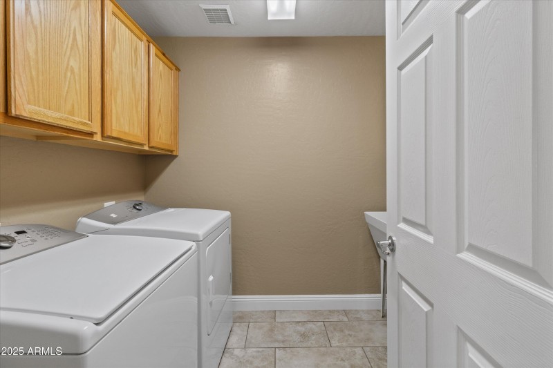 Laundry with Cabinets & W & D