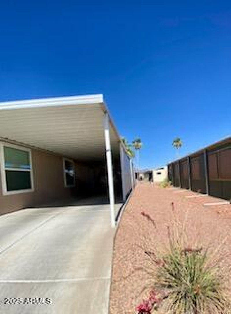 Large side lot by carport