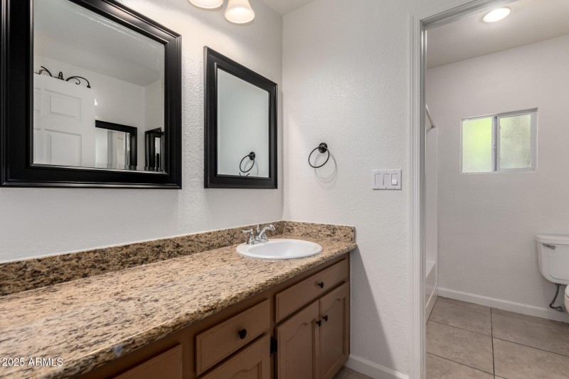 Granite Vanity with Dual Mirrors