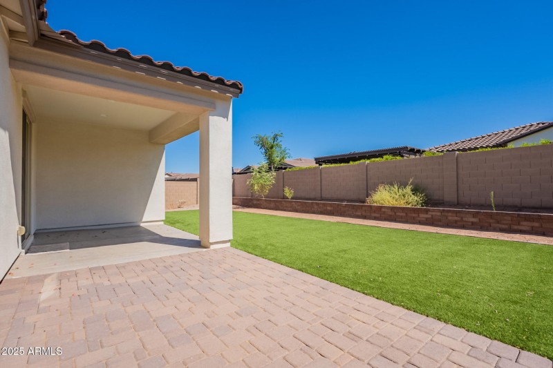 Backyard with extended paver patio