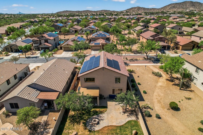 Drone view of backyard & side greenbelt