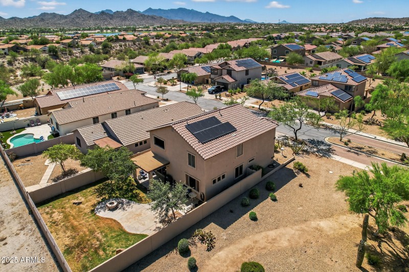 Drone view of backyard & side greenbelt