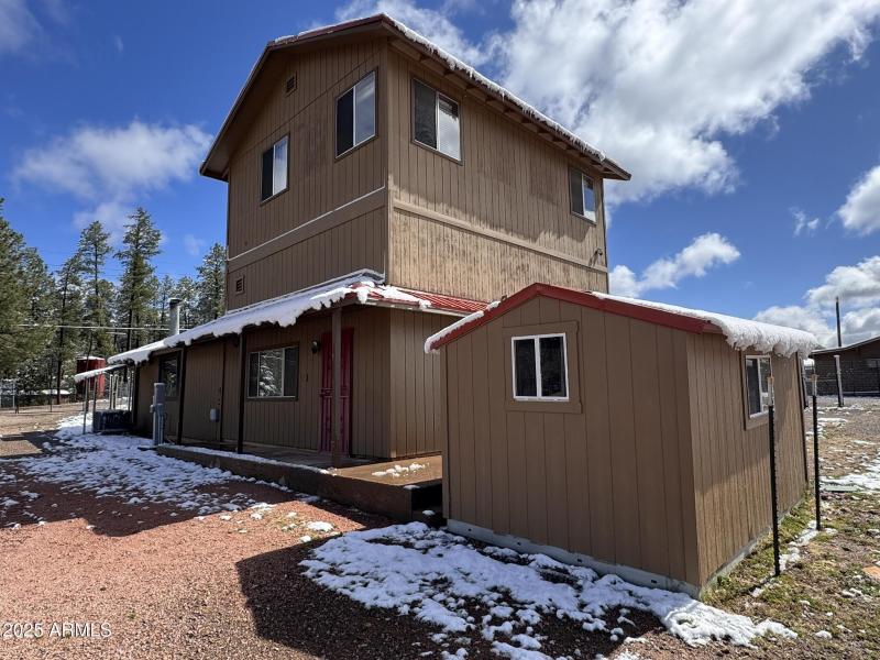 8 - Main house west side & storage shed
