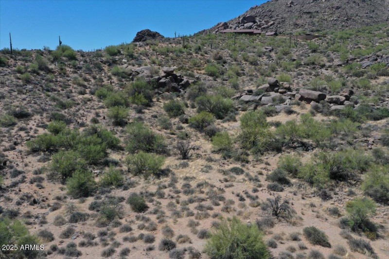 Boulder outcroppings, sloping terrain.