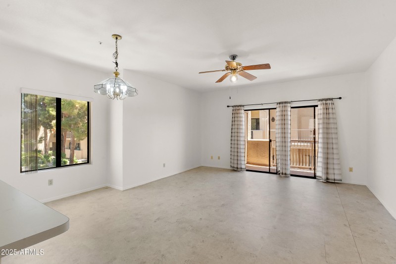 Living Area Overlooks Pool and Balcony