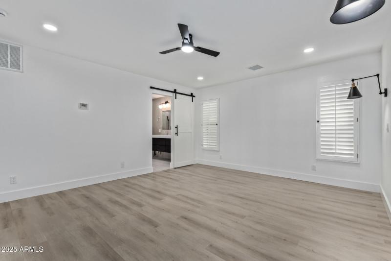 Barn door to bathroom in master