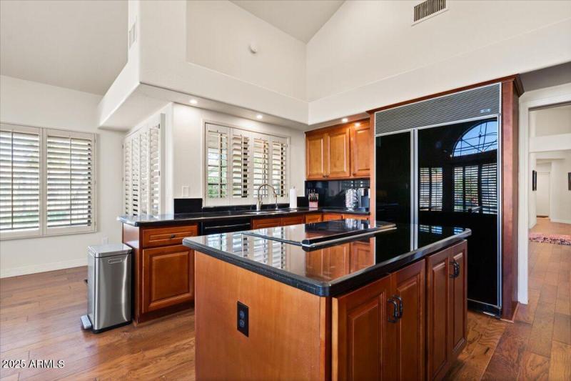 Granite and Black Appliances Throughout