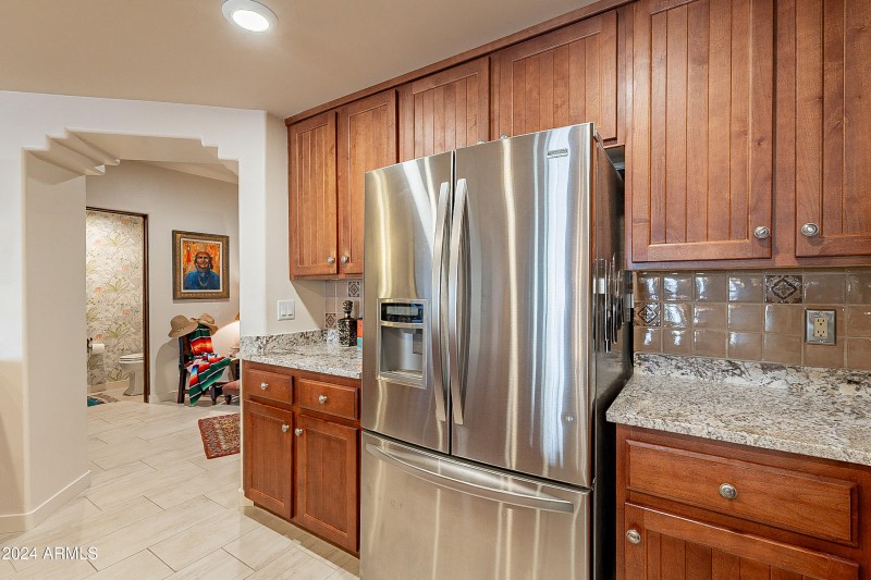 Stainless fridge and plenty of cabinets
