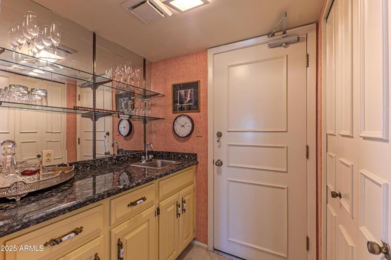 Wet bar between kitchen and living room