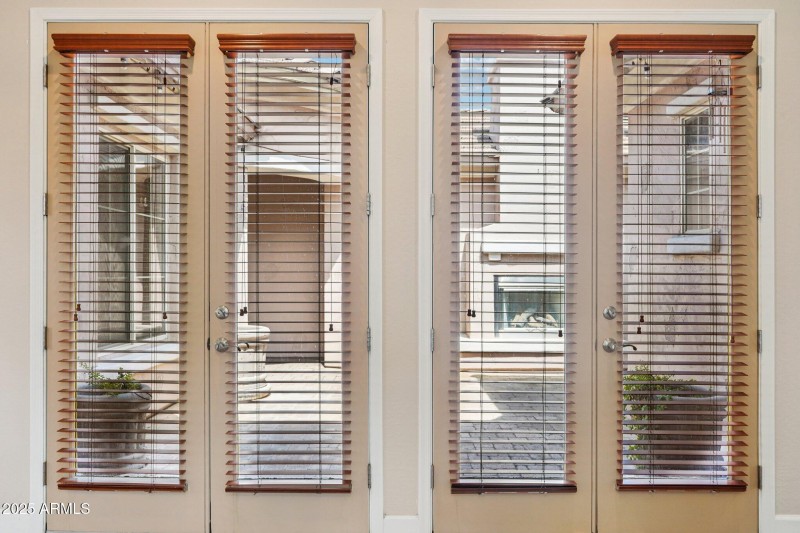 French Doors Open to Courtyard