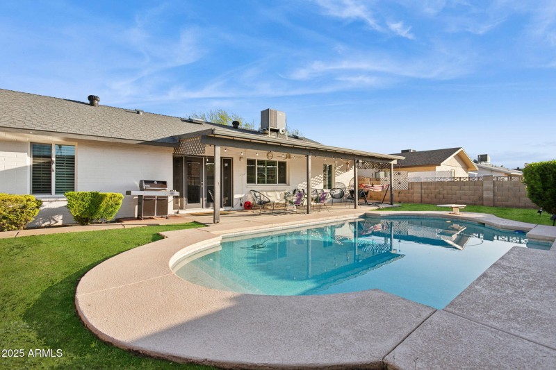 View of rear patio and pool