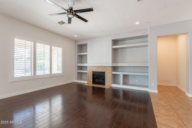 Gream Room with builktin and Fireplace