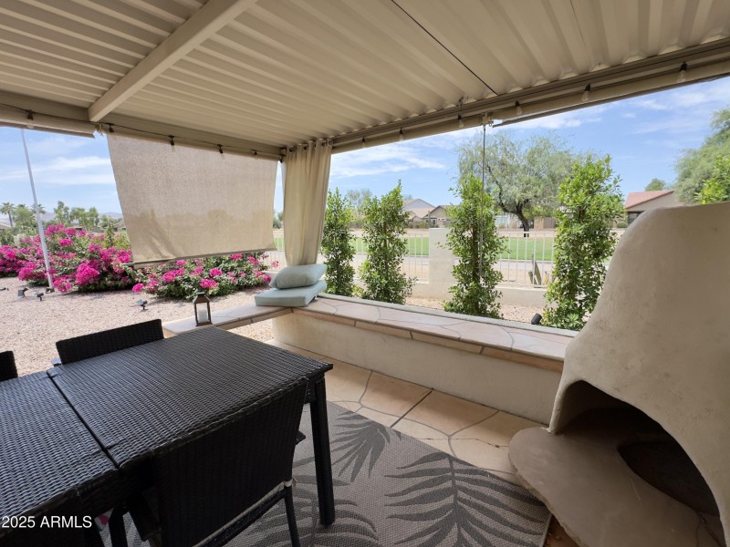 Covered outdoor living area with strin