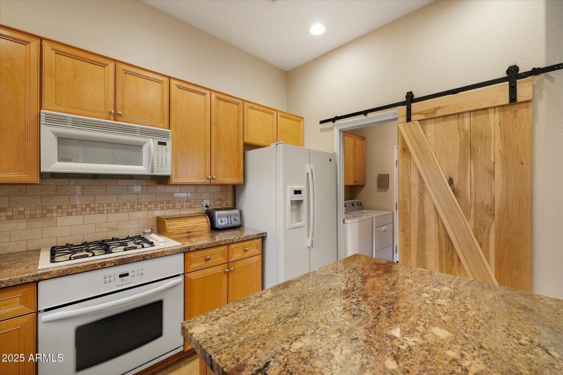 Barn door leads to laundry