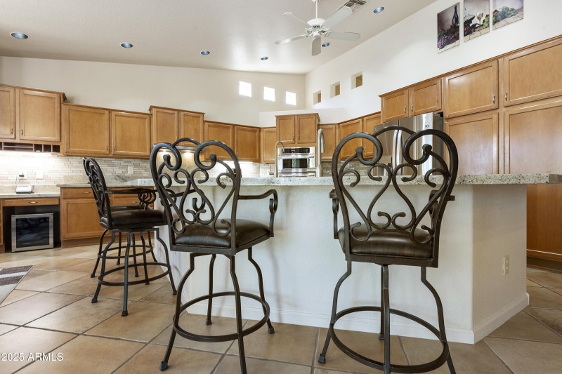 Kitchen with island breakfast bar