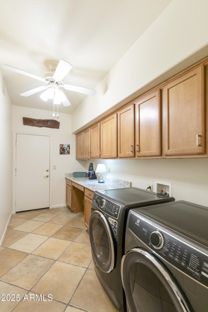 Laundry with cabinets/counter