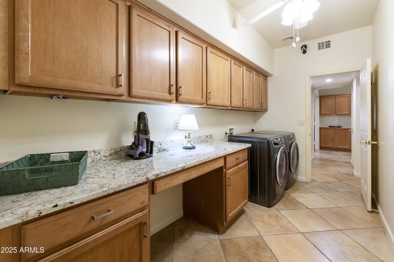 Laundry with cabinets/counter