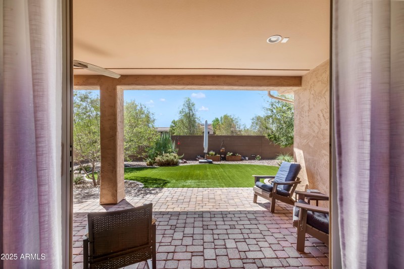 Travertine back patio turf