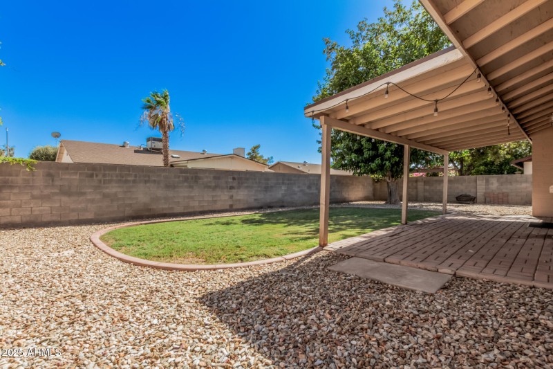 Grass and Gravel Landscaped Backyard