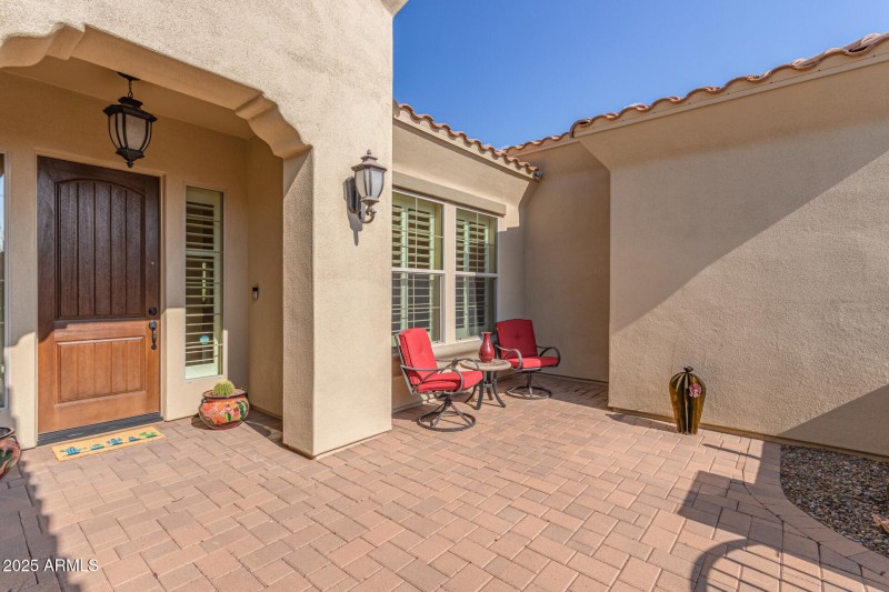 Welcoming gated front courtyard