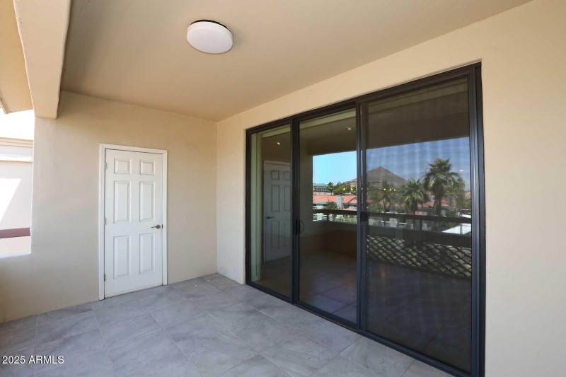 Covered Balcony - door to storage room