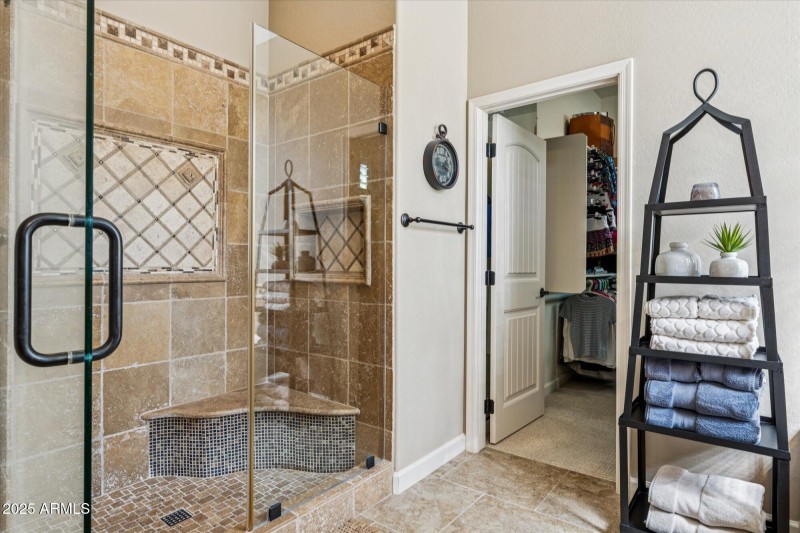 Tiled Shower and Linen Closet