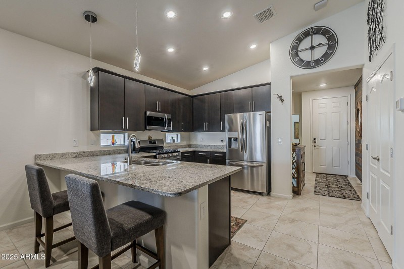Breakfast bar and granite countertops.