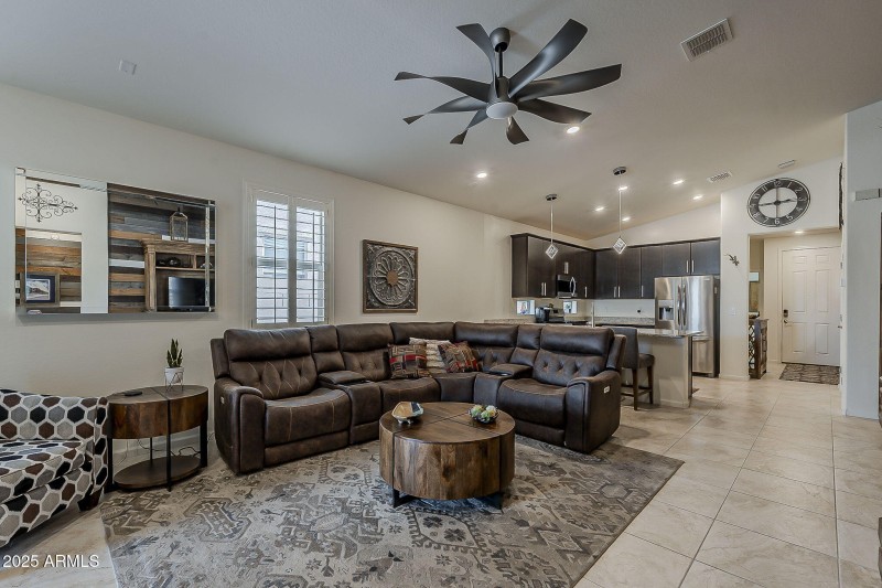 Vaulted ceiling and recessed lighting.