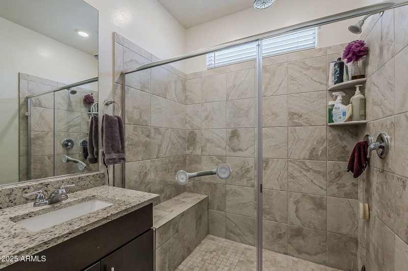 Walk-in shower with seat.