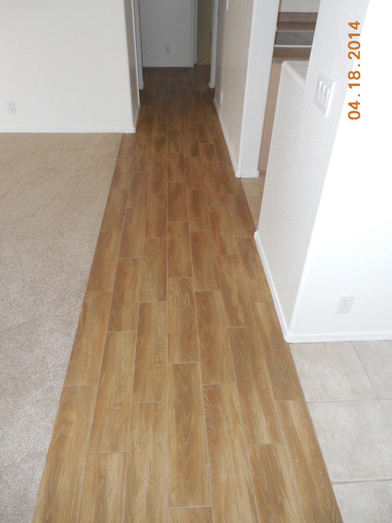 wood-look ceramic tile hallway