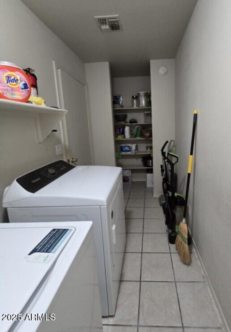 laundry room with large storage area