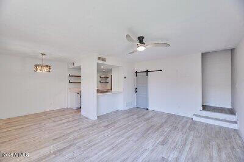 Livingroom w under stairs closet