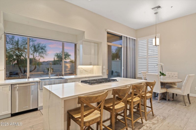 Kitchen Looks out to back yard/pool