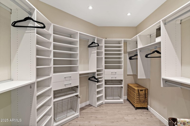 Primary Walk-in w/ Custom Cabinetry